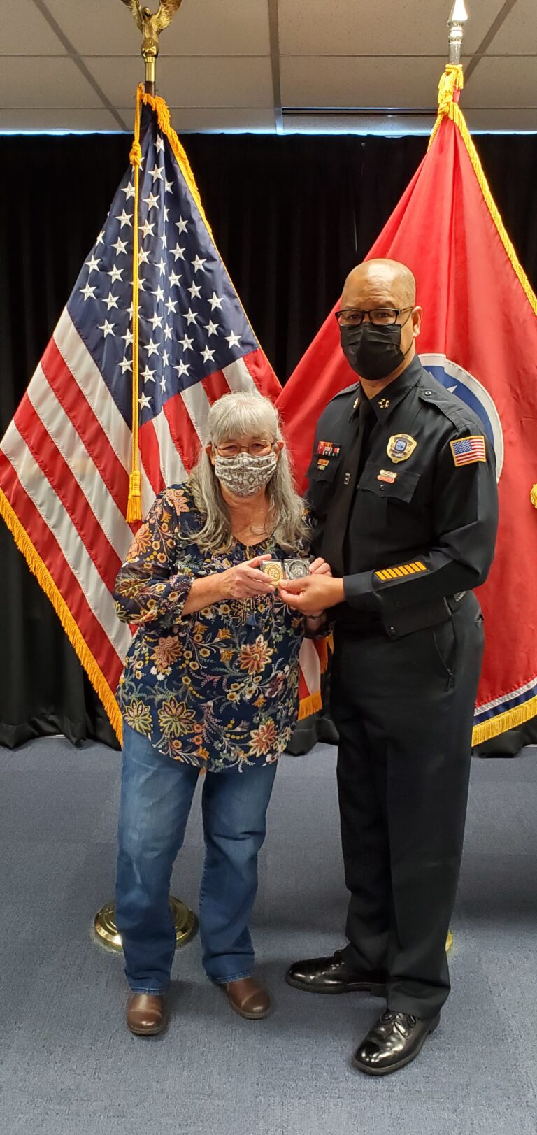 Presenting a challenge coin to a Police director